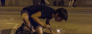 Boy exploding firecrackers