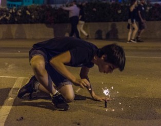 Boy exploding firecrackers