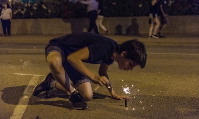 Boy exploding firecrackers